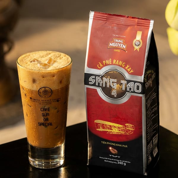 Iced Cafe Sua Da Special next to a Trung Nguyen Sang Tao 4 coffee bag.